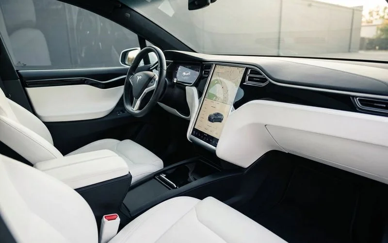 Immaculately clean vehicle interior showing both well maintained dashboard surfaces and protected seat material