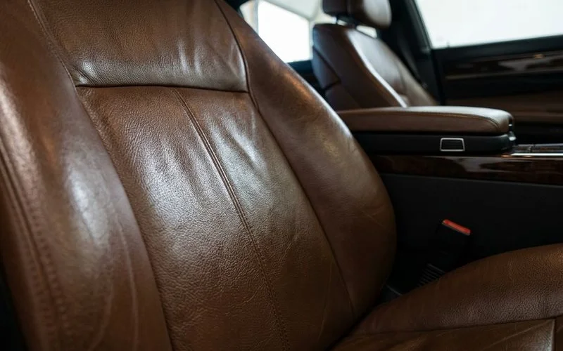Detailed view of leather seats after professional conditioning and protection treatment